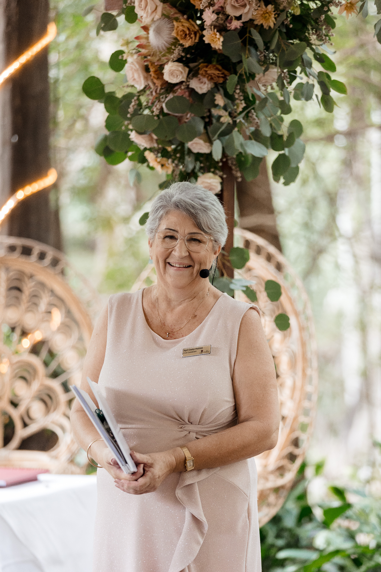 April Daley-Holmes, Gold Coast civil celebrant, smiling at an outdoor ceremony